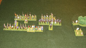The Normans hold back on the left and charge with the retainers.  They overpower the Bondi on the right while the bondi on the left is well supported and puts up a fight.  The Captain would be swept away with his unit of Retainers.