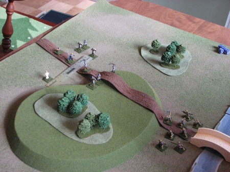 Here is the setup after turn 1.  Goblins are guarding the bridge.  Figures are Caesar Miniatures Elves and Goblin Factory Goblins.  The Hobbit is a Chariot Miniatures (Magister Militum) 15mm Hobbit.